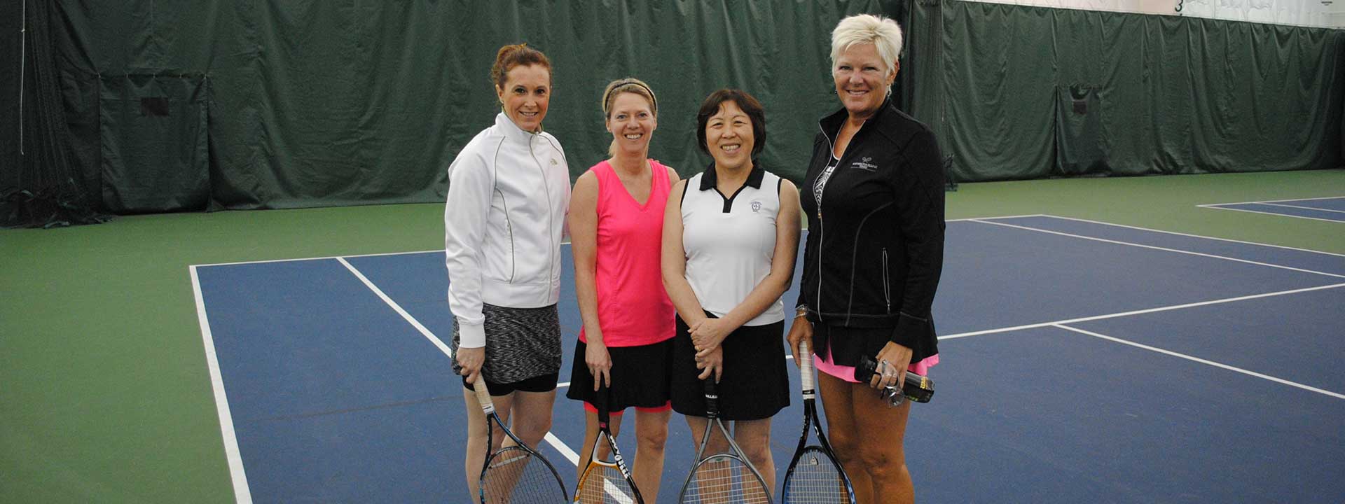 Four ladies ready to play tennis